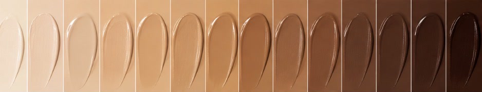 Fourteen foundation shades swatched side by side, from very light to very deep